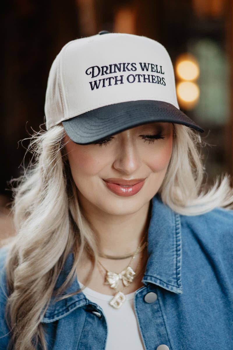 Drinks Well With Others Vintage Trucker Hat in Black and Tan