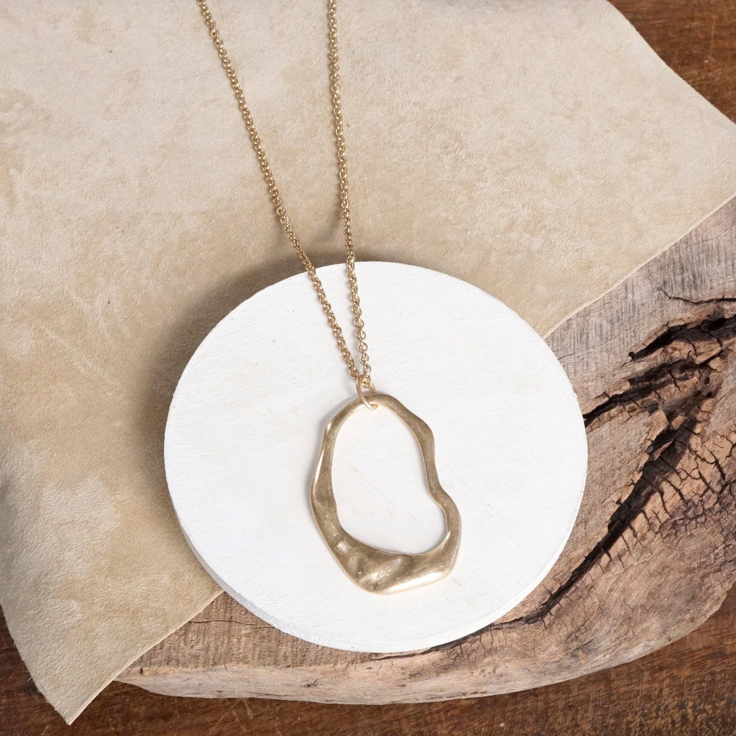 Minimalist Asymmetric Circle in Worn Gold