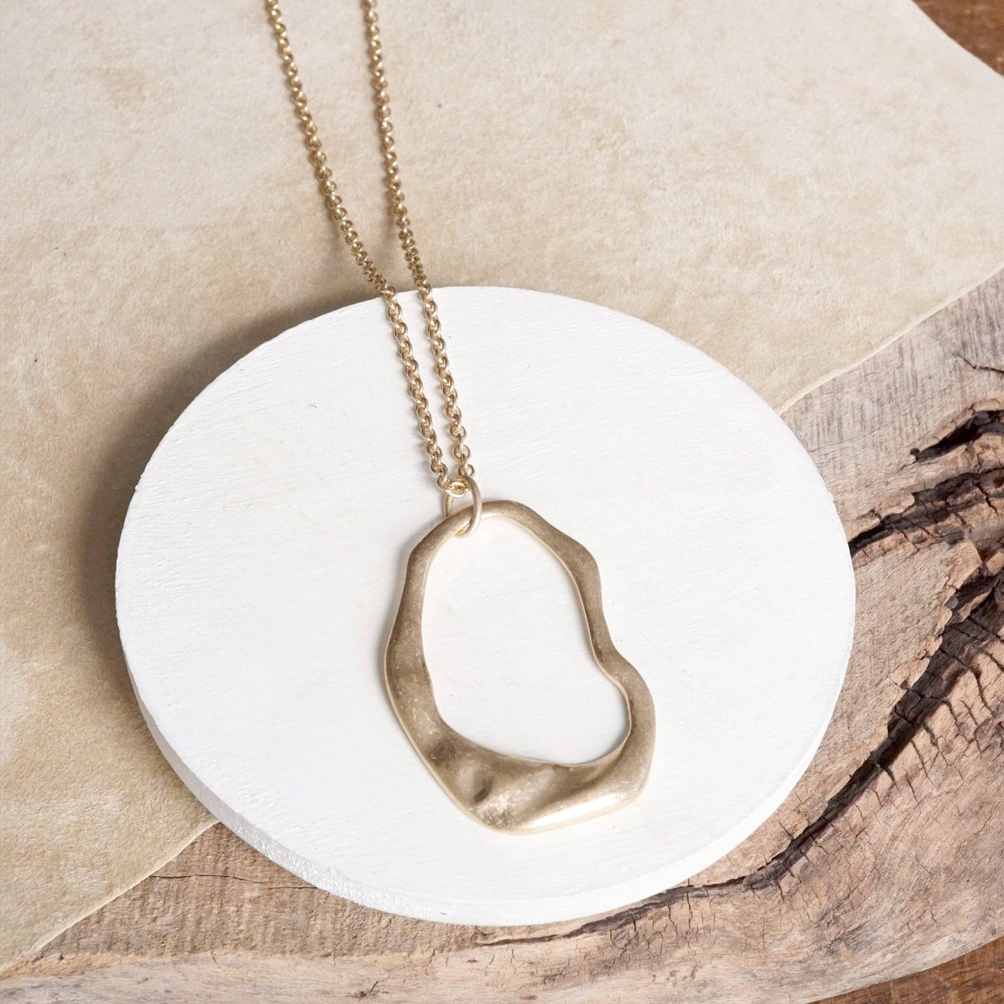 Minimalist Asymmetric Circle in Worn Gold
