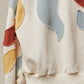 Alissa Abstract Patch Hoodie with Kangaroo Pocket in Cream