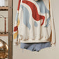Alissa Abstract Patch Hoodie with Kangaroo Pocket in Cream