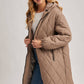 Norah Quilted Puffer Jacket in Black